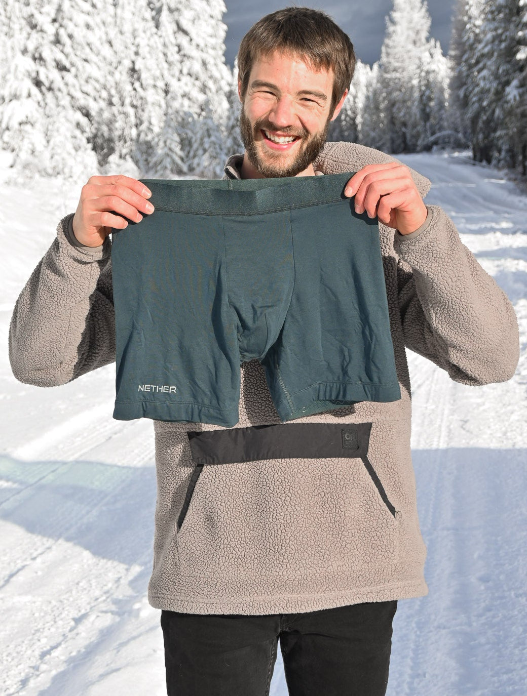 Holding up a pair of Nether boxer briefs outside in the snow