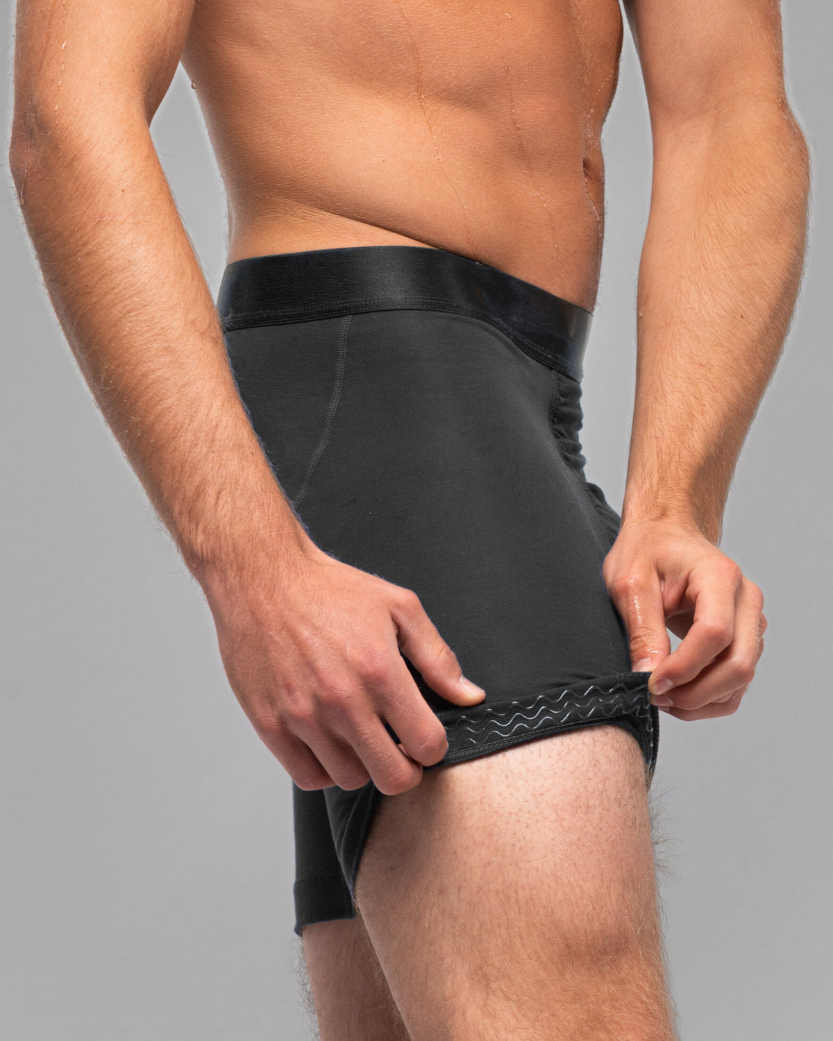 Leg hem of the Nether Roam Boxer Brief turned back to show the Trail Grip silicone band
