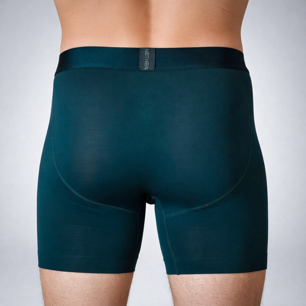 Nether Boxer Brief in Forest - back view on model showing four-way stretch fit, seamless rear panel construction, and black jacquard waistband with NETHER logo