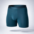 Nether Boxer Brief in Forest - angled front view showing Valley Pouch anatomical design, Trail Grip leg bands, and 6-inch inseam in TENCEL Lyocell fabric