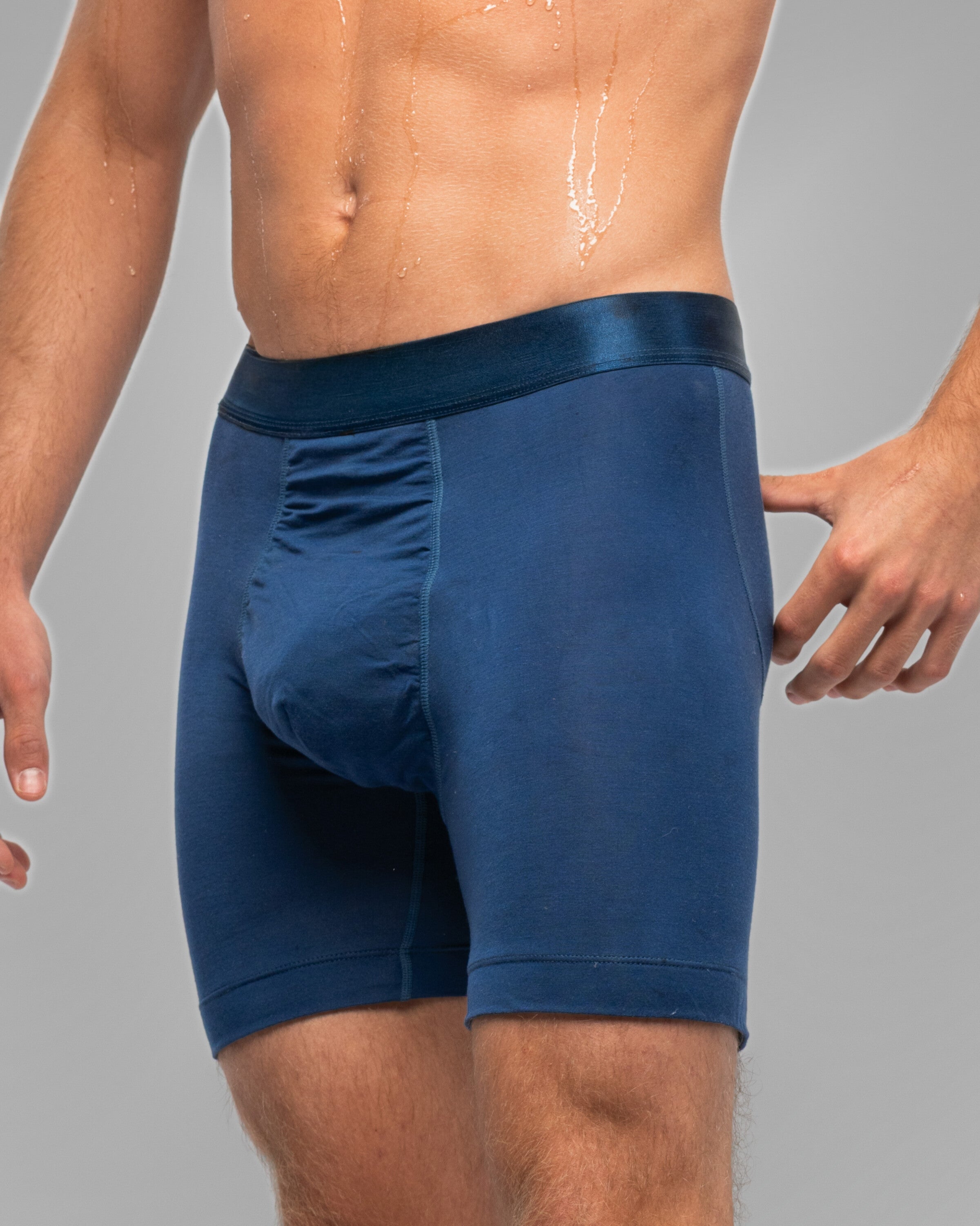 [Archive] Nether Roam Boxer Brief in navy, three-quarter waist-down view showing the pouch panel seam