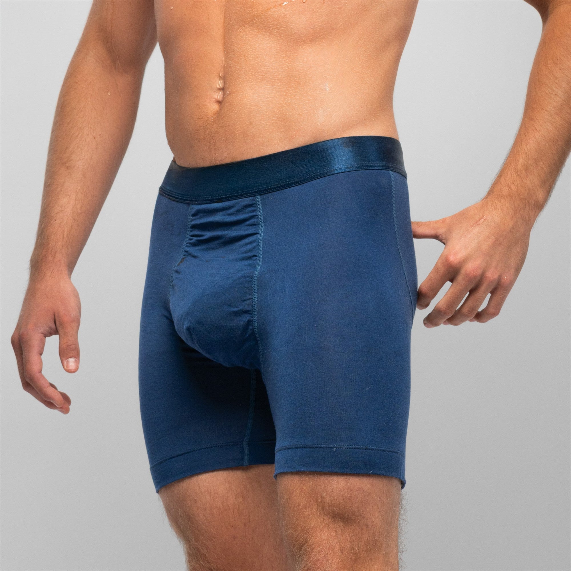 [Abyss] Nether Roam Boxer Brief in navy, three-quarter waist-down view showing the pouch panel seam