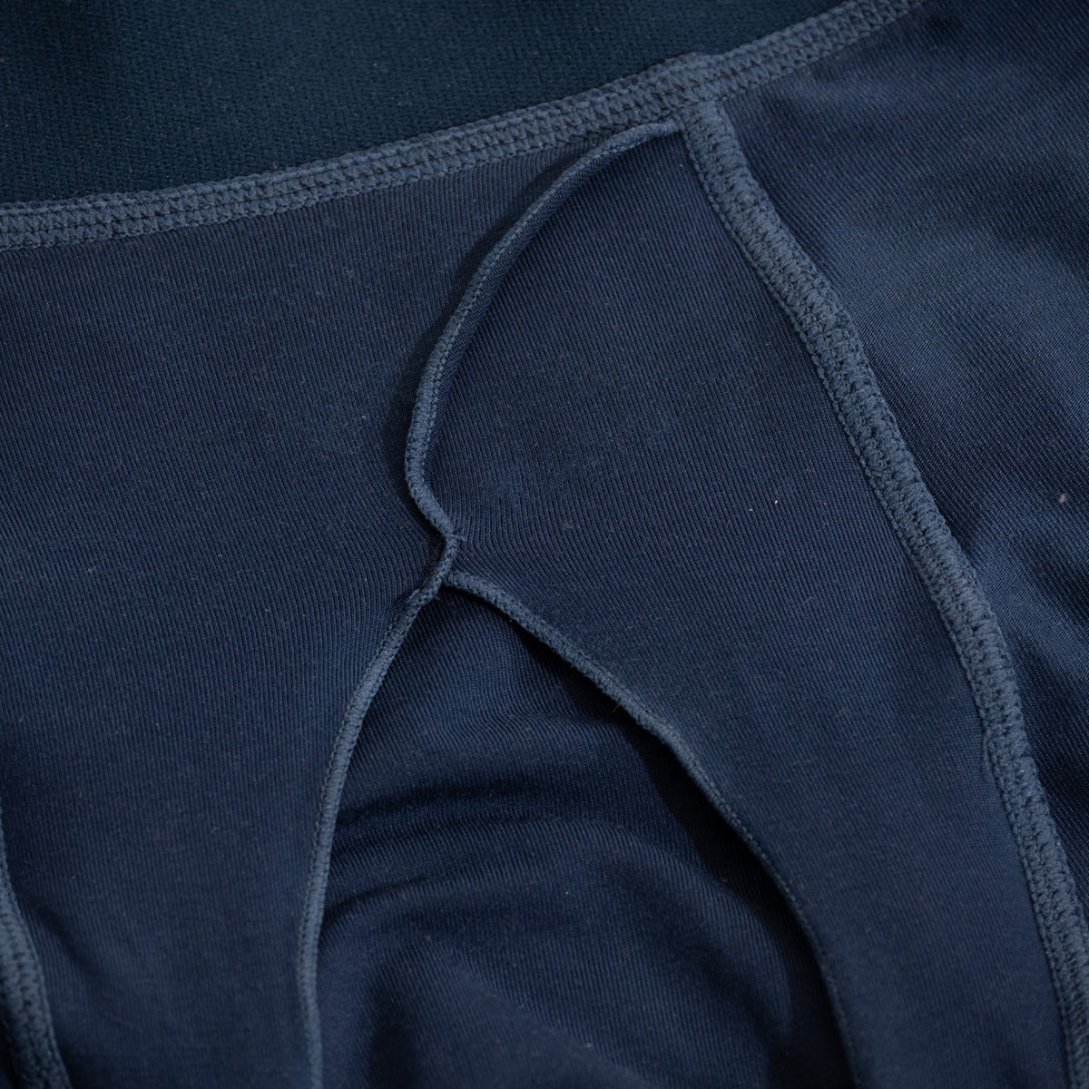 [Abyss] Nether Roam Boxer Brief in navy, close-up of the flat-lock seam where the pouch panel meets the leg