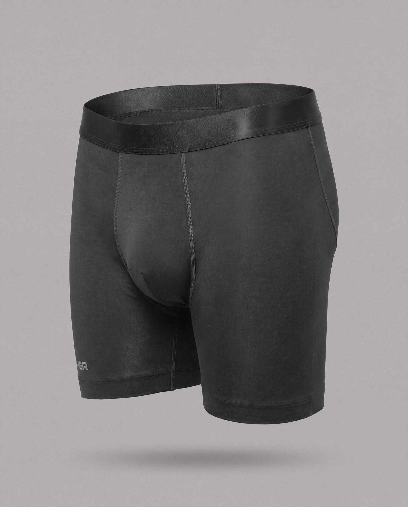 The Nether Roam Boxer Brief in Midnight, front view showing the full cut and satin waistband