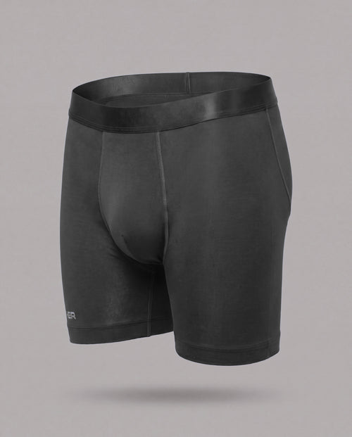 [Midnight 1] Nether Roam Boxer Brief in black, front three-quarter view showing the full cut, satin waistband and Valley Pouch