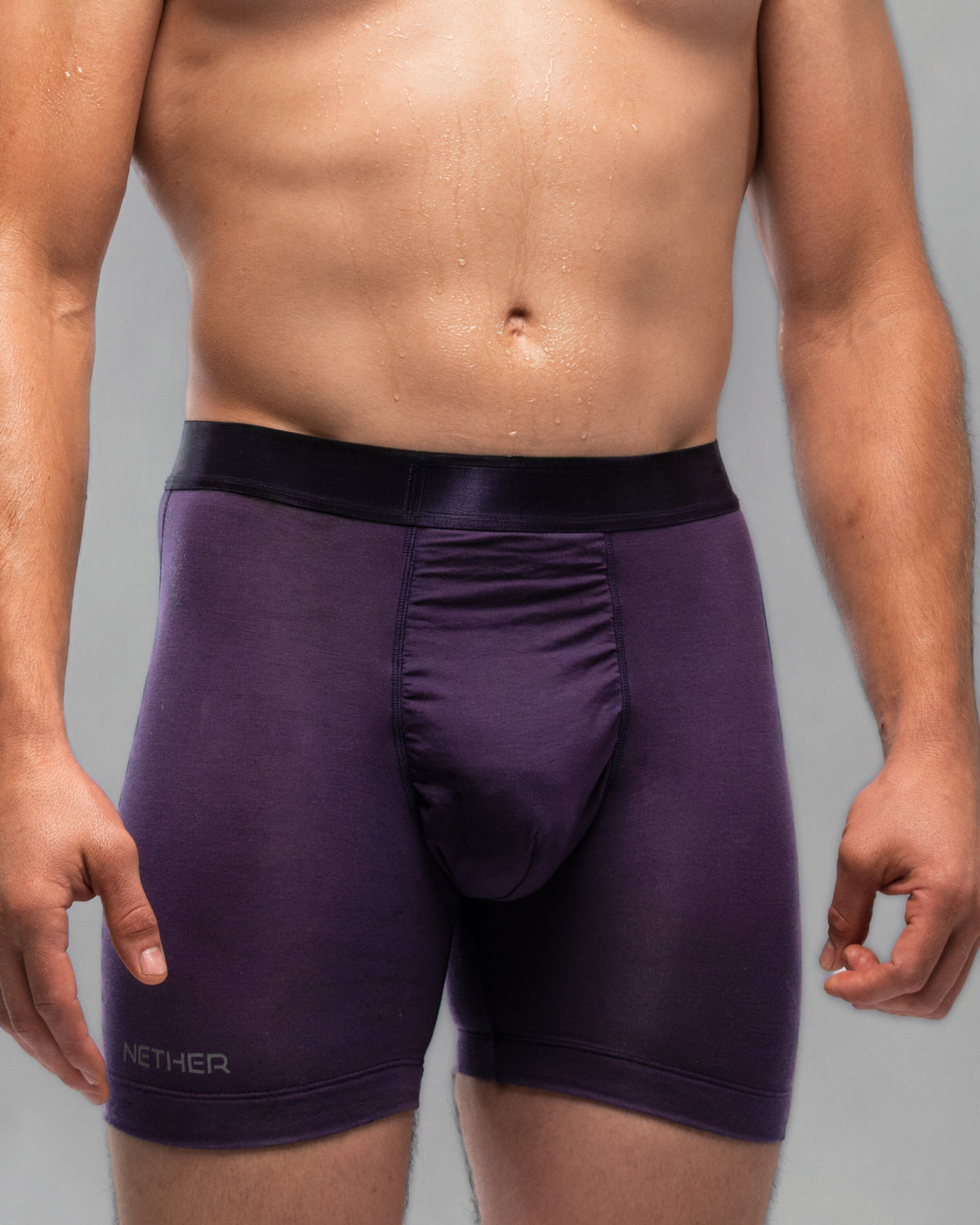 [Archive] Nether Roam Boxer Brief in dark purple, front waist-down view showing the Valley Pouch panel