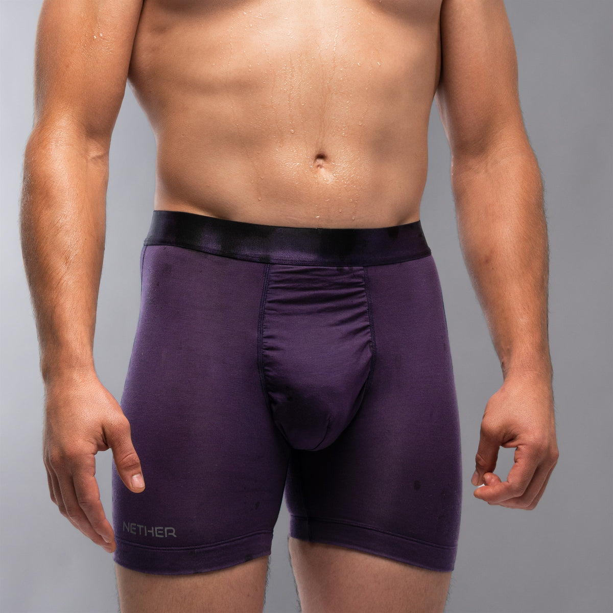 [Storm] Nether Roam Boxer Brief in dark purple, front waist-down view showing the Valley Pouch panel and NETHER leg print